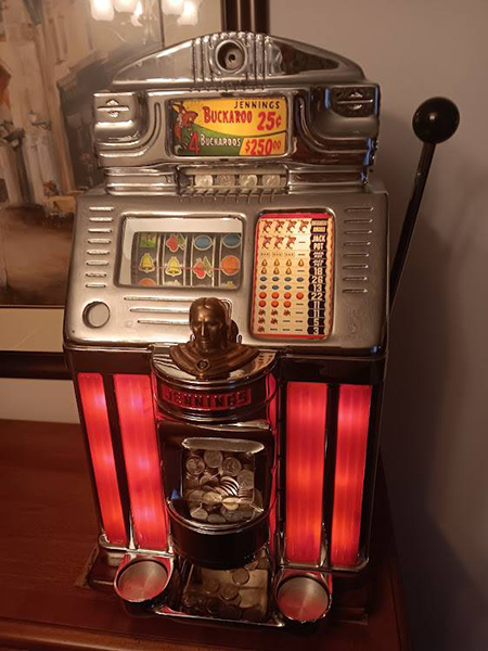 An antique classic slot machine named the Jennings Buckaroo